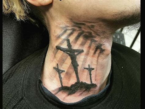 cross tattoo on the back of neck|three crosses on neck tattoo.